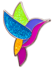Colorful hummingbird-shaped pin with glittery wings on a white background