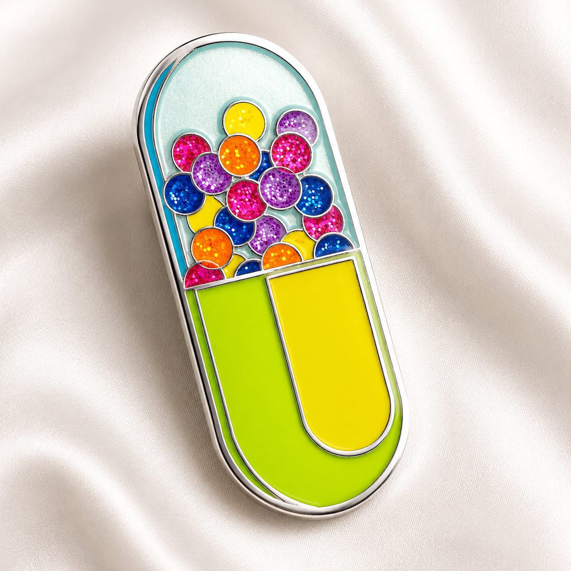 Colorful pill-shaped enamel pin