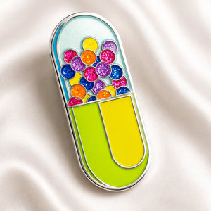 Colorful pill-shaped enamel pin