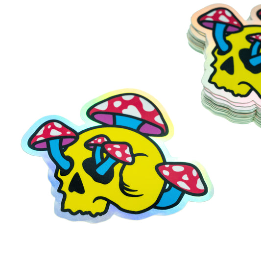 Stack of colorful stickers with skull and mushroom design on a white background
