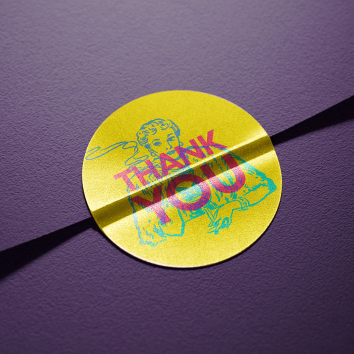 Yellow sticker with colorful design and text on a purple background