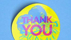 Round yellow sticker with 'THANK YOU' text on a blue background