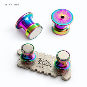 Enlarged detail of Radbacks magnetic disks and locking pin openings above an example installed on a Spot Studio Art pin.