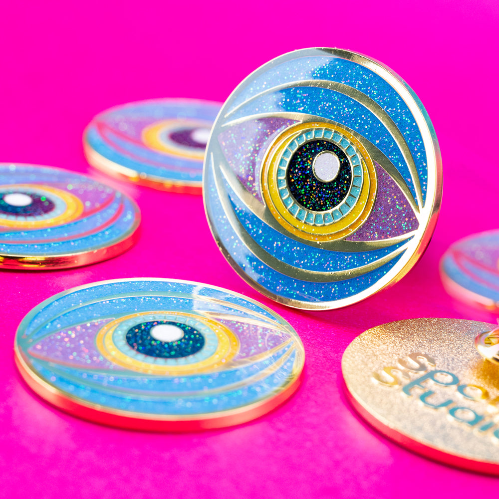 Golden Gaze: Vibrant Glitter Eye Enamel Pin