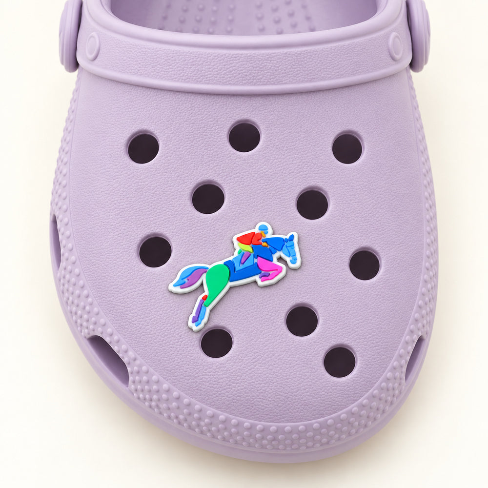 Overhead view of the 1.25-inch horse jumping shoe charm on a lilac Croc.